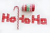 Candy cane and washi tape letters reading 'Ho, ho, ho'