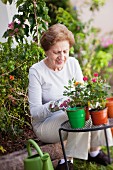 An older woman gardening