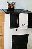 Old, masonry kitchen stove with oven
