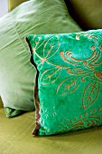 Green scatter cushion with devoré pattern