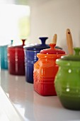 Colourful ceramic pots with lids