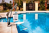 Pool lift by swimming pool; Azusa; California; USA