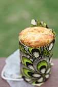 Cornbread for a picnic baked in a tin can & wrapped in colourful print fabric