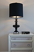 Bedside table with black lit lamp