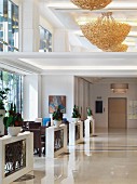 Elegant chandeliers in seating area of hotel