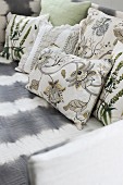 Scatter cushions with various floral, country-house-style covers