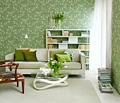 Living room with white and green flowered wallpaper