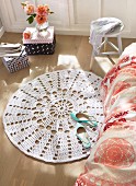 A white crocheted doily as a rug