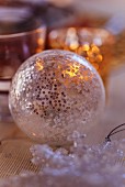 Transparent Christmas tree bauble decorating table (close-up)