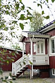 Traditional Swedish house with steps leading to front porch