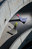 Rocking loungers made from outdoor material in graphic patterns on concrete ramp