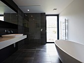 Point 7, Winchester, United Kingdom. Architect: Dan Brill Architects, 2014. Black and white designer bathroom with free-standing bathtub