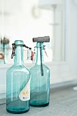 Vintage, swing-top bottles made of turquoise glass
