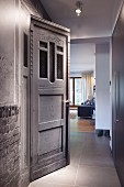 Vintage door in modern hallway