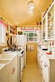 Narrow kitchen in beach house; Oregon, USA