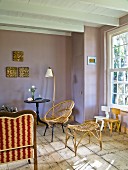 Wicker stool and chair in country-house interior painted lilac