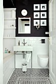 Small bathroom with subway tiles, charcoal wall and decorative floor tiles