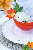 Place setting decorated with flowers & doilies