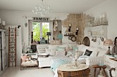Sofa set with collection of pastel scatter cushions in luxuriously decorated shabby-chic interior