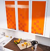 Kitchen cabinets revamped with decorative adhesive film