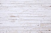 A surface of white-painted wooden boards