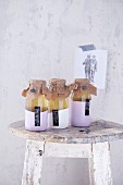 Elderflower syrup in three sealed bottles as a gift