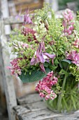 Glass vase of pink lupins