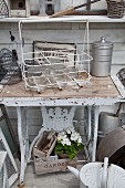 Sewing machine frame repurposed as table in garden shed