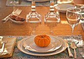Autumnal place setting with pumpkin