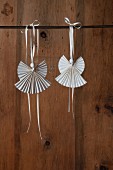 Angel pendants made from folded paper