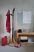 Upcycling - coat stand made from old skis and stacked shoeboxes next to vintage bench