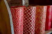 Row of vases with red and white retro patterns
