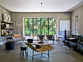 Interior with concrete walls and floors and furniture in 50s and 60s styles