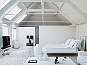 Elegant, white bedroom with exposed roof structure