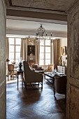 Elegant, French-style interior with antique furniture and chandelier