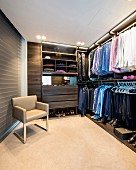 Luxurious dressing room with modern, open-fronted wardrobes