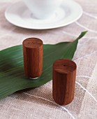 Wooden salt and pepper shakers on linen tablecloth