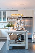 Cosily lit, vintage-style kitchen with island counter