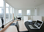 Study with glass wall overlooking roof terrace