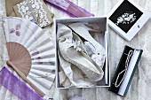 White high heels with lace effect and other bridal accessories
