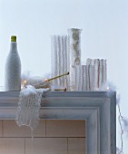 Vases decorated with white knitted covers