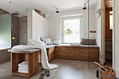 A designer, spa bathroom with a comfortable chill-out bench and a sauna