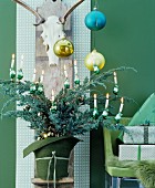 Christmas arrangement in shades of green with bouquet of conifer branches