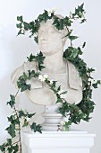 Roman-style bust raped with ivy tendrils