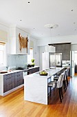 Large kitchen with island and upholstered bar stools