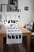 Modern Easter table decorated with rabbit motifs in black and white
