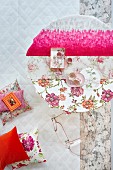 Hot pink as modern accent amongst feminine floral patterns on round table