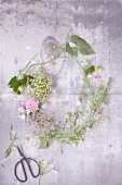 A floral wreath of flowers and leaves