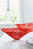 Homemade decorative bowls made from red lace