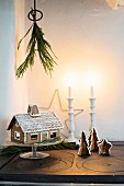 Gingerbread house and gingerbread trees on top of old cooker